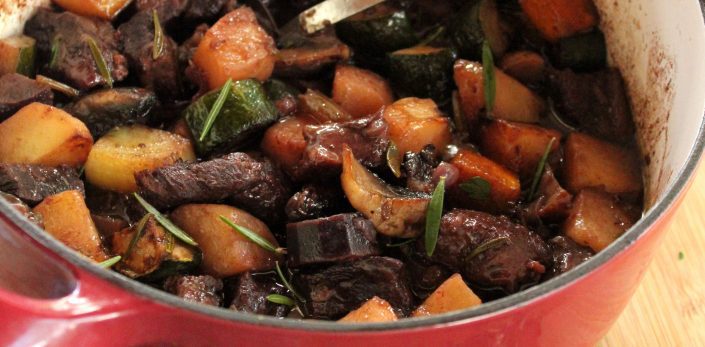 Slow cooked beef with vegetables, red wine and winter herbs
